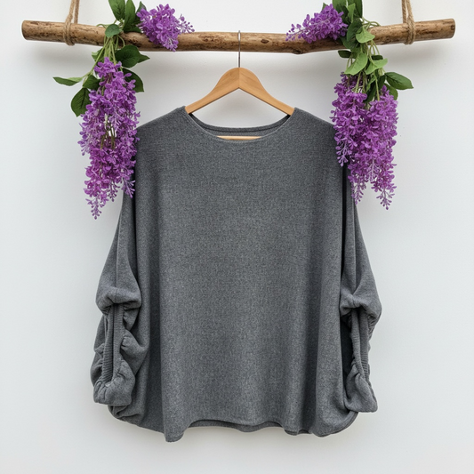 Pull à manches bouffantes avec des boutons